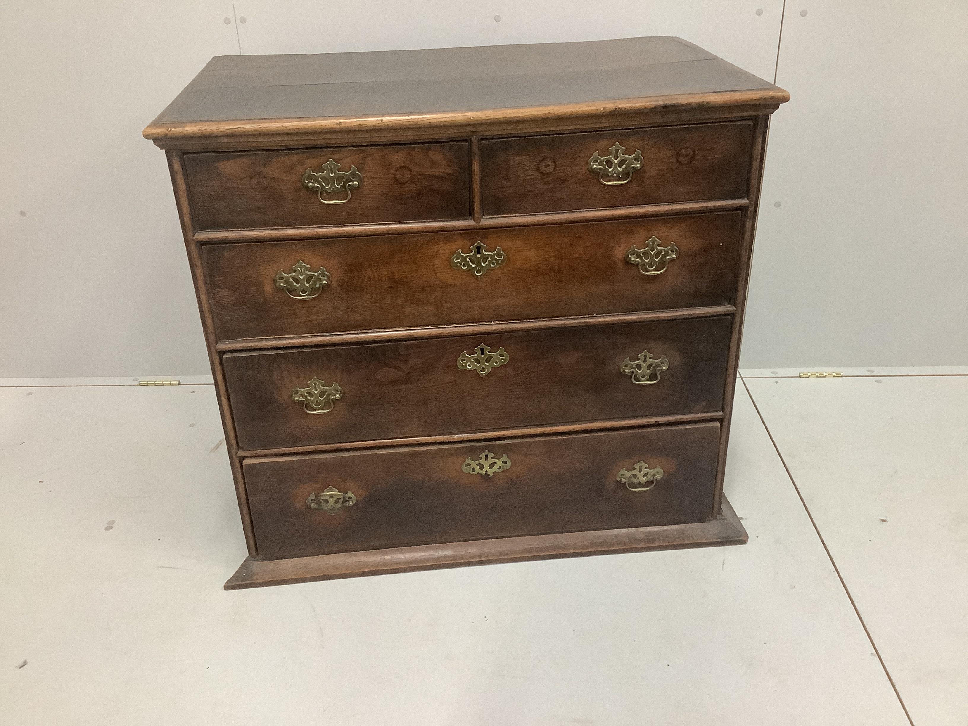 A mid 18th century oak chest of two short and three long drawers, width 97cm, depth 57cm, height 86cm